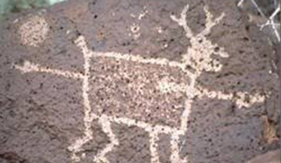 Petroglyph of a deer or pronghorn pierced by a spear